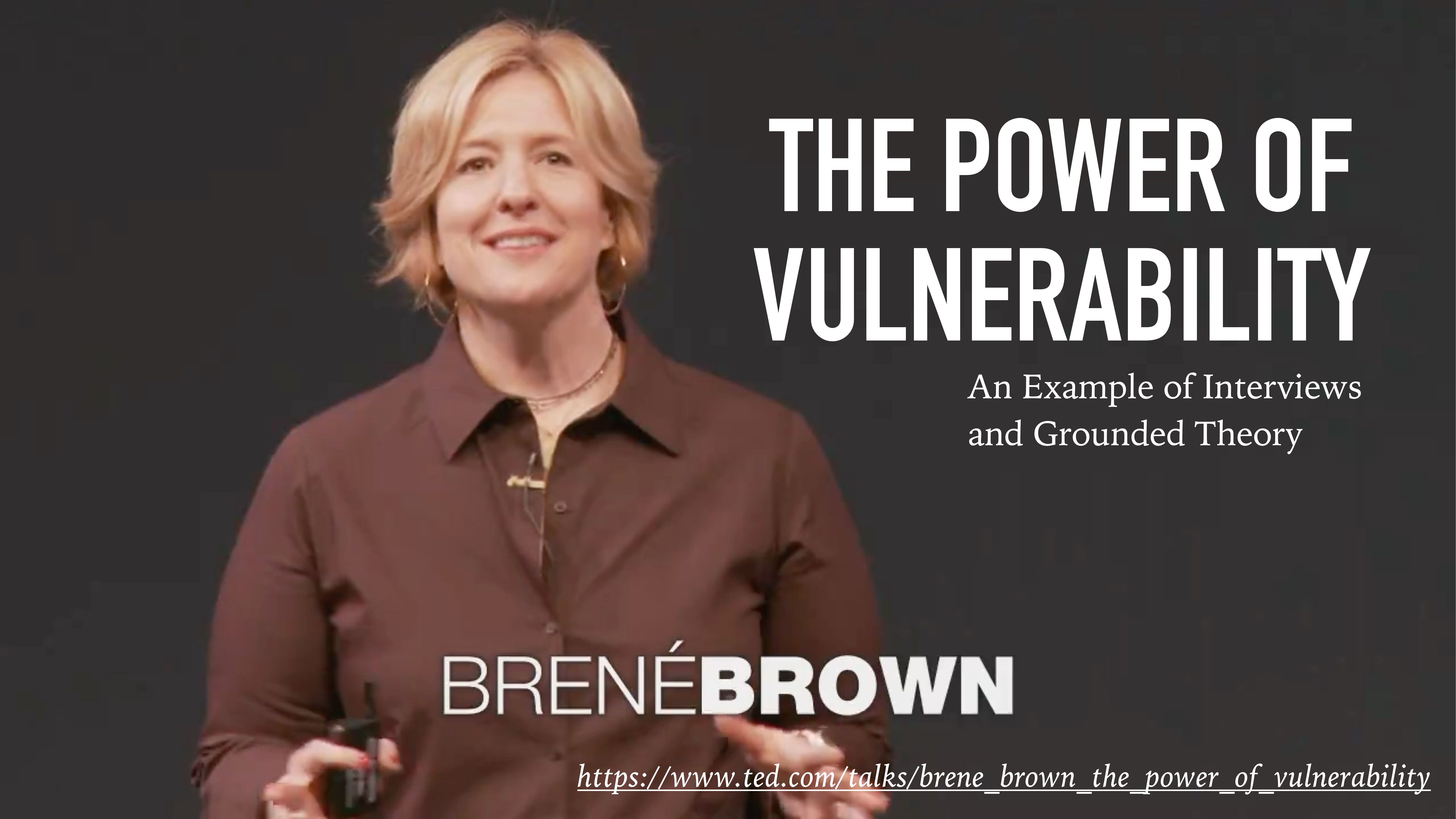 A person stands speaking on stage, holding a clicker. The slide reads: 'THE POWER OF VULNERABILITY: An Example of Interviews and Grounded Theory.' Link: 'ted.com/talks/brene_brown_the_power_of_vulnerability.'