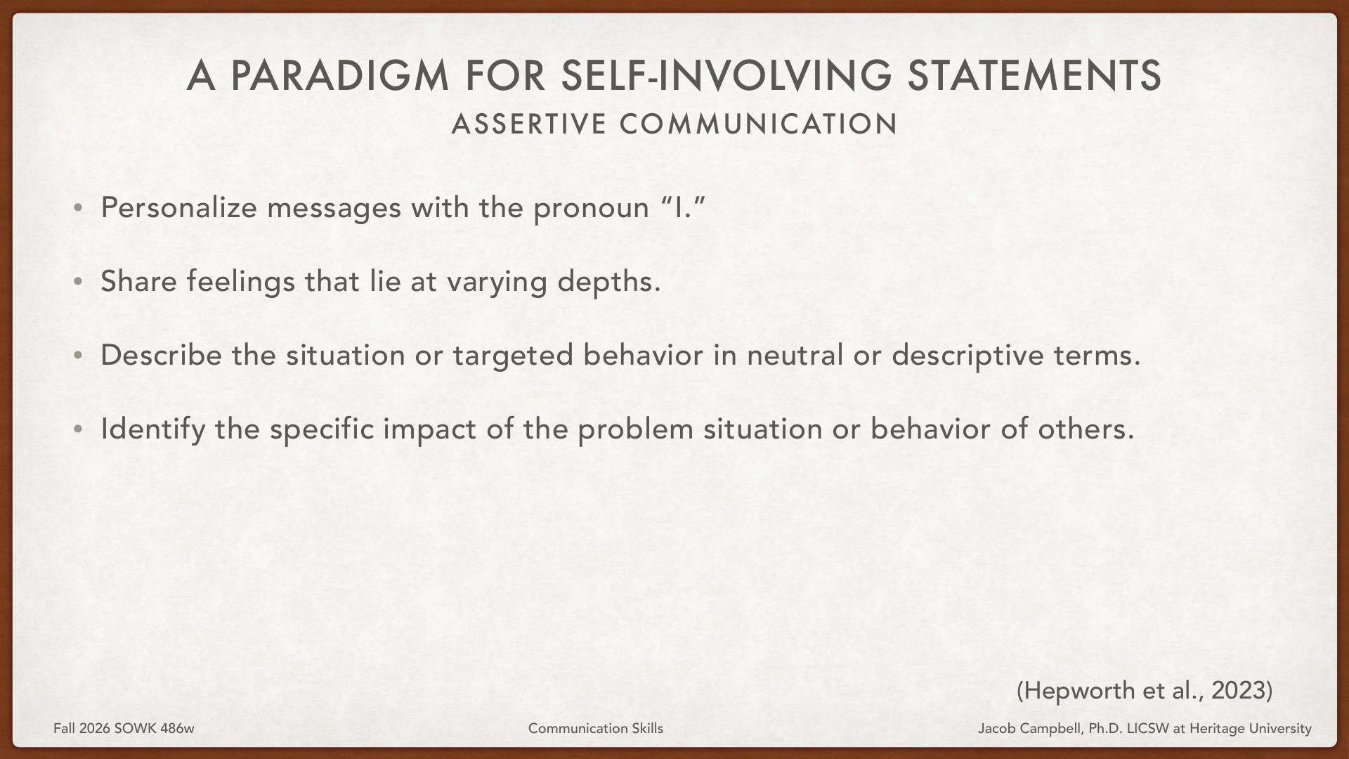 A presentation slide displaying 'A Paradigm for Self-Involving Statements: Assertive Communication' with four bullet-point guidelines: personalize messages with 'I,' share feelings at varying depths, describe situations neutrally, and identify specific impact of others' behavior. Attribution to Hepworth et al., 2023; footer shows Fall 2026 SOWK 486w, Communication Skills, Jacob Campbell, Ph.D. LICSW at Heritage University.