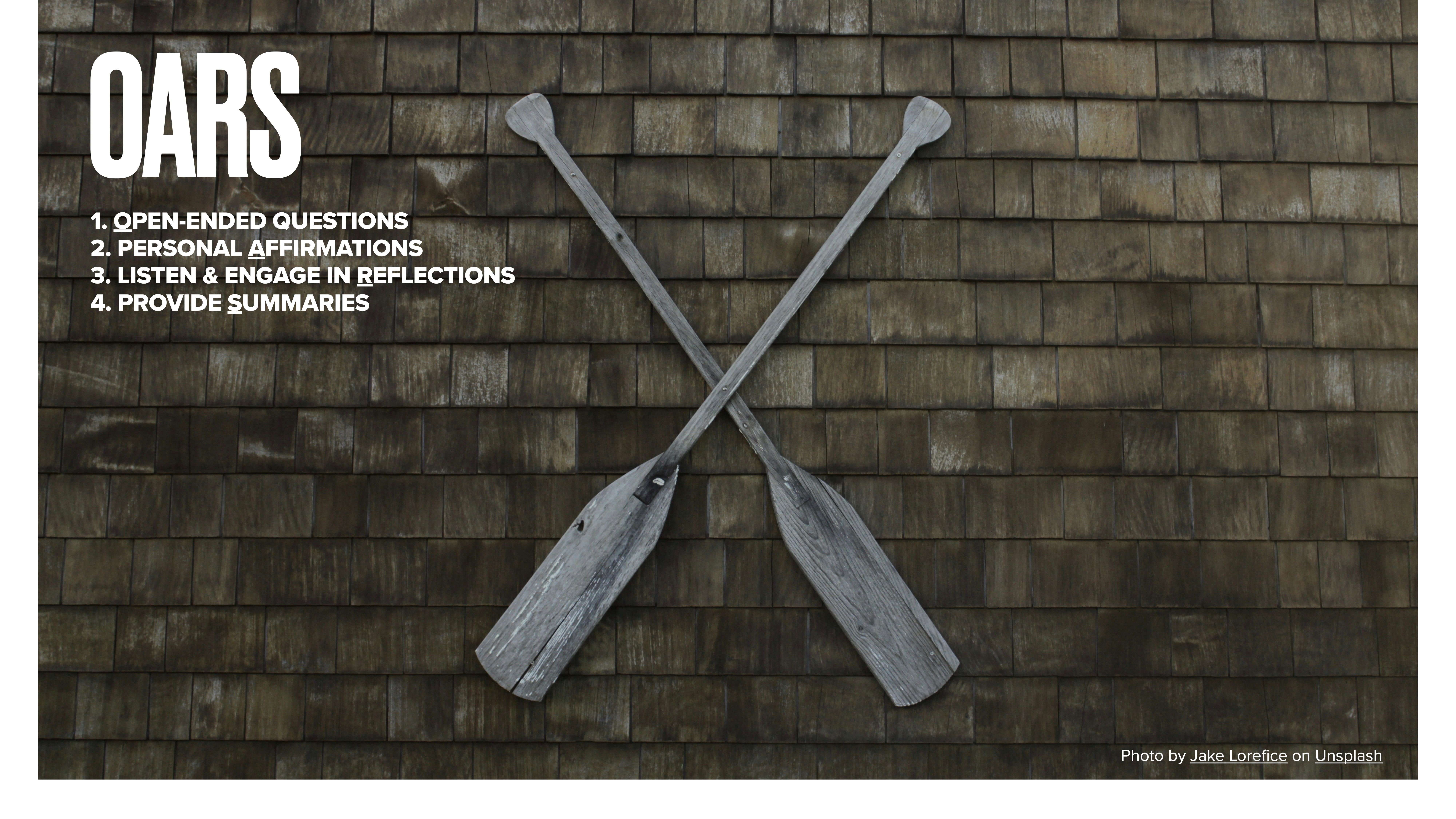 Two crossed wooden oars are mounted on a shingled wall. The text reads:OARS1. OPEN-ENDED QUESTIONS2. PERSONAL AFFIRMATIONS3. LISTEN & ENGAGE IN REFLECTIONS4. PROVIDE SUMMARIES